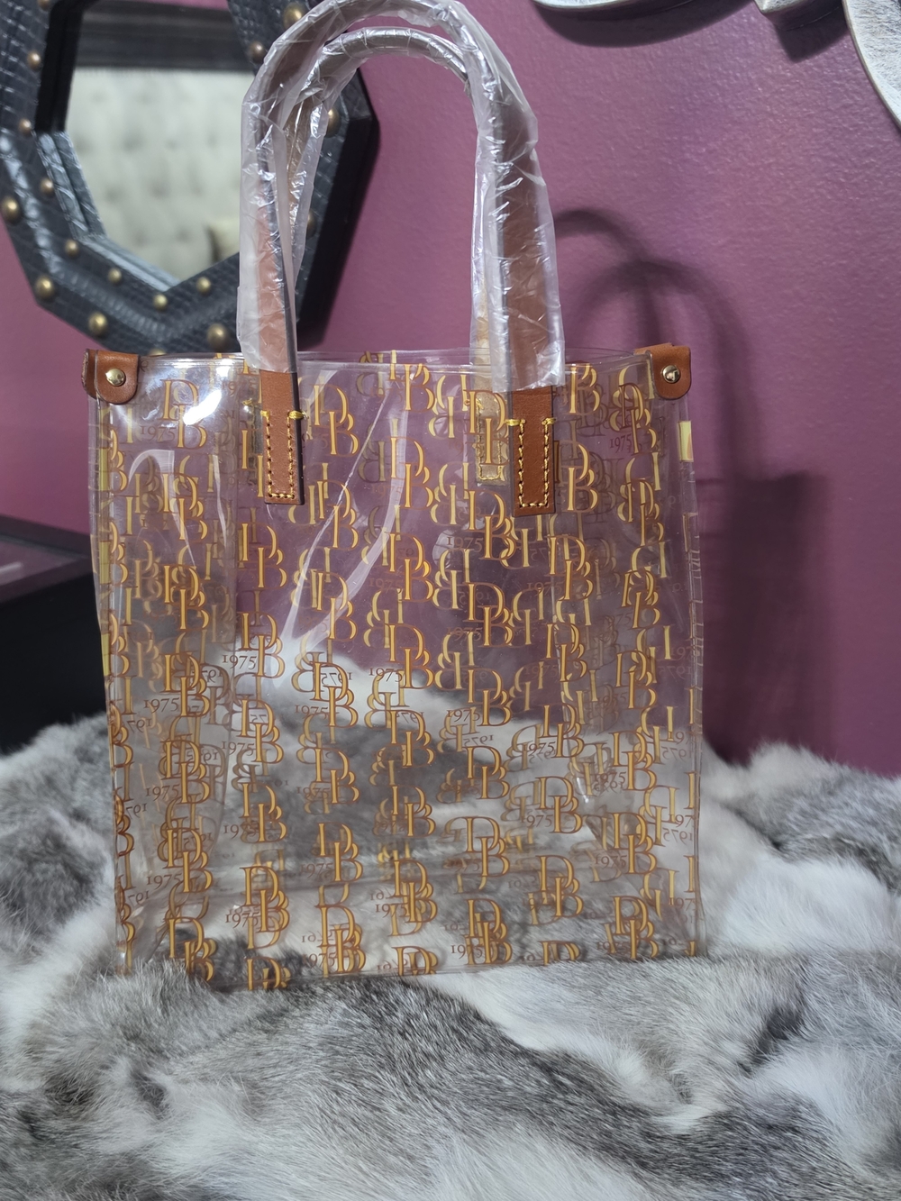 Dooney & Bourke Clear Tote with Gold Logo Print and Tan Trim